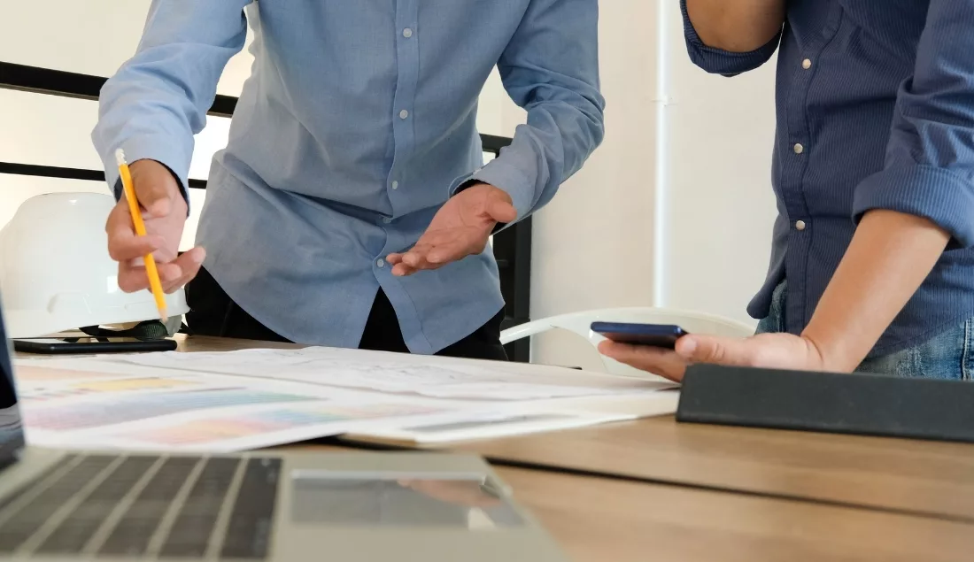 Designers discussing project plans at a table